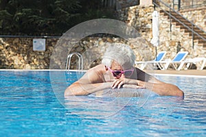 Senior man floating on water