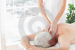 Senior man getting back massage