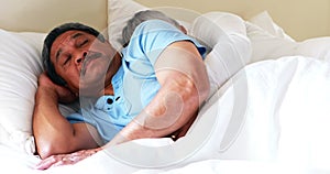 Senior man getting disturbed with woman snoring on bed 4k