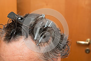 Senior Man getting a haircut at home.