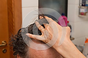 Senior Man getting a haircut at home.