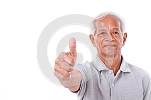Senior man giving thumb up