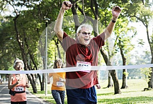 Senior man happily won the race