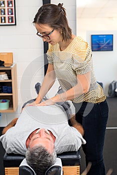Senior man having chiropractic adjustment.