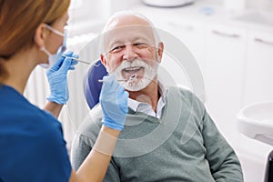 Senior man having dental checkup