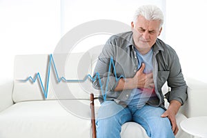 Senior man having heart attack