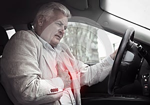 Senior man having heart attack