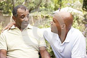 Senior Man Having Serious Conversation Adult Son