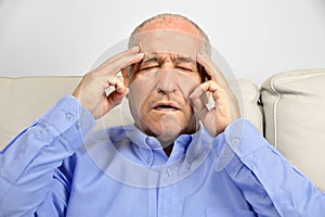Senior man with head pain