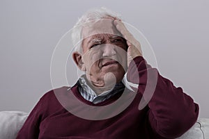 Senior man with headache