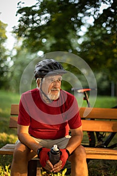 Senior man with his mountain bike