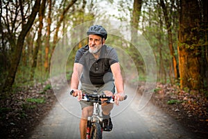 Senior man on his mountain bike outdoors