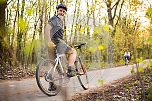 Senior man on his mountain bike outdoors