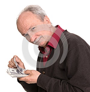 Senior man holding at dollar bills