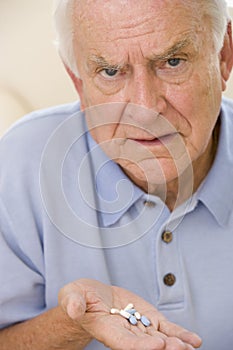 Senior Man Holding Prescription Drugs