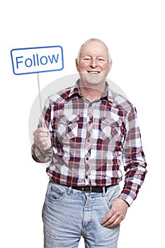 Senior man holding a social media sign smiling