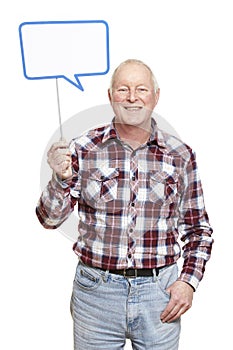 Senior man holding a speech bubble sign smiling