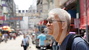 Senior man with hong kong urban architecture scene