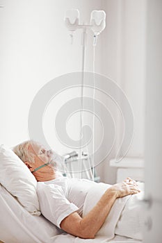Senior Man in Hospital Bed