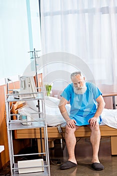 Senior man on hospital bed