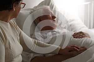 Senior man in hospital bed