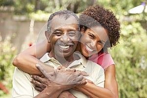 Senior Man Hugging Adult Daughter