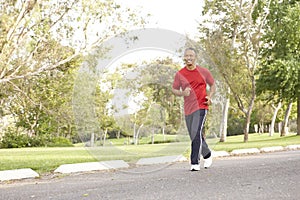 Senior Man Jogging In Park