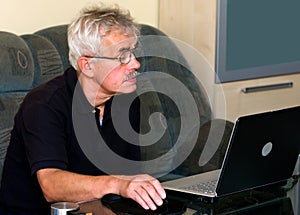 Senior man and laptop