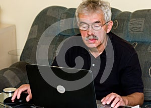 Senior man and laptop