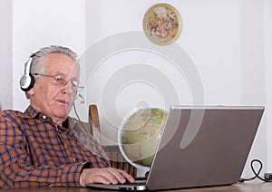 Senior man with laptop