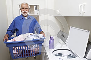 Senior Man With Laundry Basket photo
