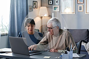 Senior man learning to use computer