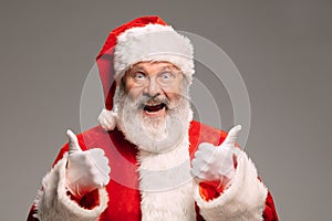 Senior man like Santa Claus isolated on grey studio background