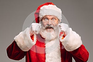 Senior man like Santa Claus isolated on grey studio background