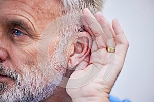 Senior man, listening and hand on ear or curious guy with gesture to hear gossip, conversation or announcement. Hearing