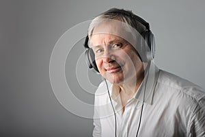 Senior man listening music