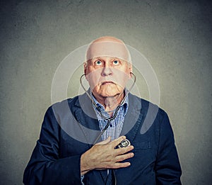 Senior man listening to his heart with stethoscope