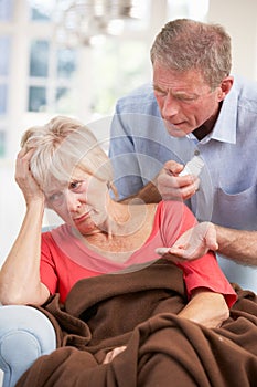 Senior man looking after sick wife