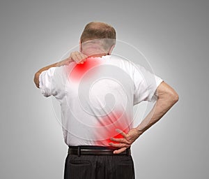 Senior man with lower and upper back pain