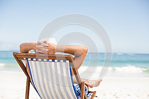 Senior man lying in a sunchair