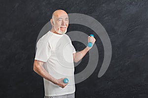 Senior man making exercise with dumbbells