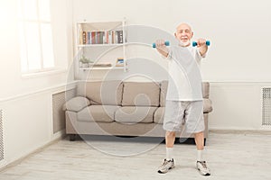 Senior man making exercise with dumbbells