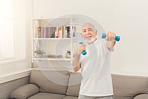 Senior man making exercise with dumbbells