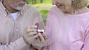 Senior man making marriage proposal to lady, dating sites for older people