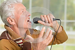 Senior man with microphone