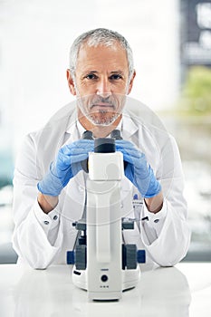 Senior man, microscope and portrait of scientist in forensic science, breakthrough or discovery at laboratory. Serious