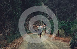 Senior man in the middle of the road in the forrest photo