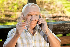 Senior man with mobile phone.