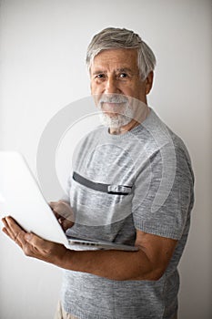 Senior man with a modern laptop computer