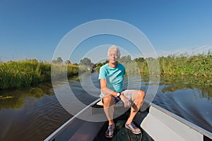 Senior man in motor boat